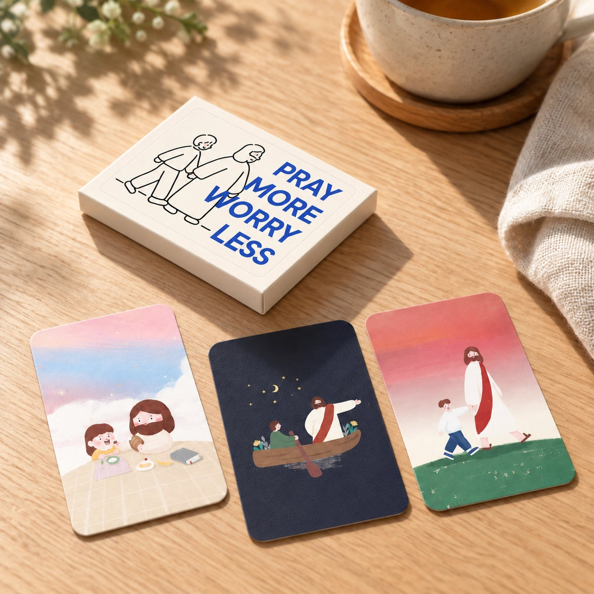 Pray More Worry Less Christian mini card set styled on a warm wooden table