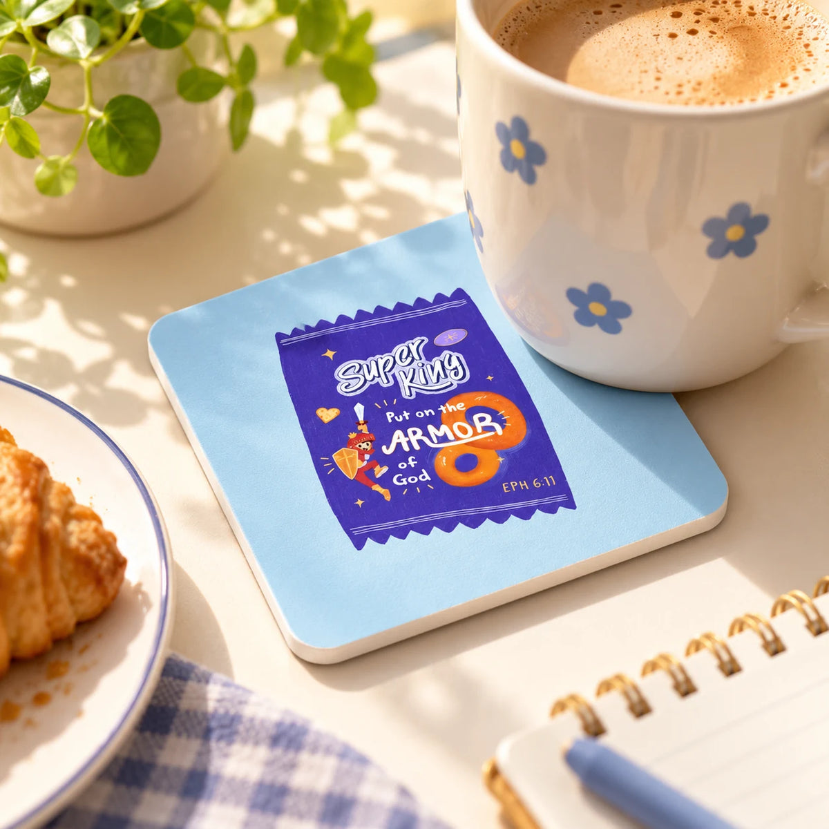 Super King armour of God blue coaster with a mug on a sunny tabletop