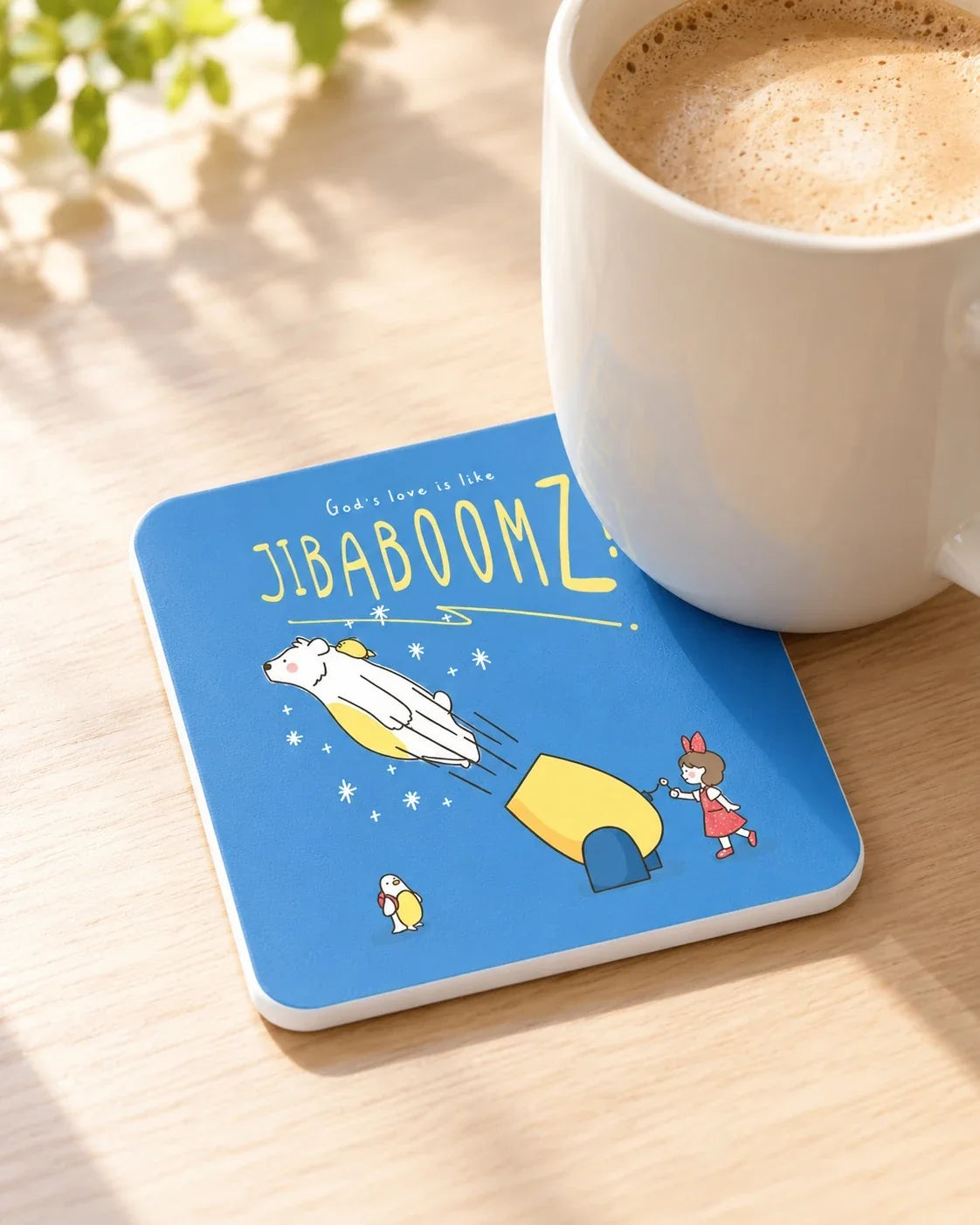 Blue Jibaboomz coaster holding coffee cup