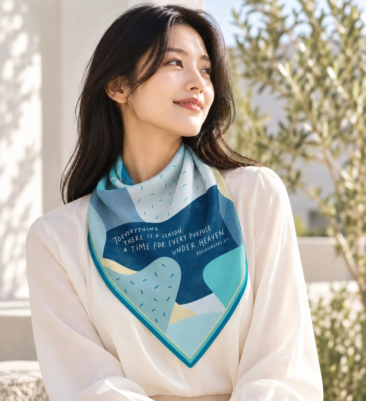 A Time for Every Purpose scarf worn with a white blouse in a natural lifestyle scene