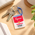 Rejoice Always soup acrylic keychain by keys on a desk
