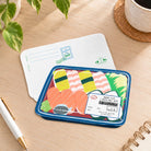 Trust in the Lord sushi set card on desk with reverse side