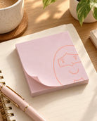 Jesus Is Always with Me pink sticky note pad on a journal