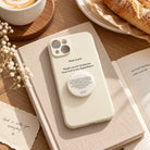 Cream Christian phone case with Be Anxious for Nothing phone grip in warm café flatlay