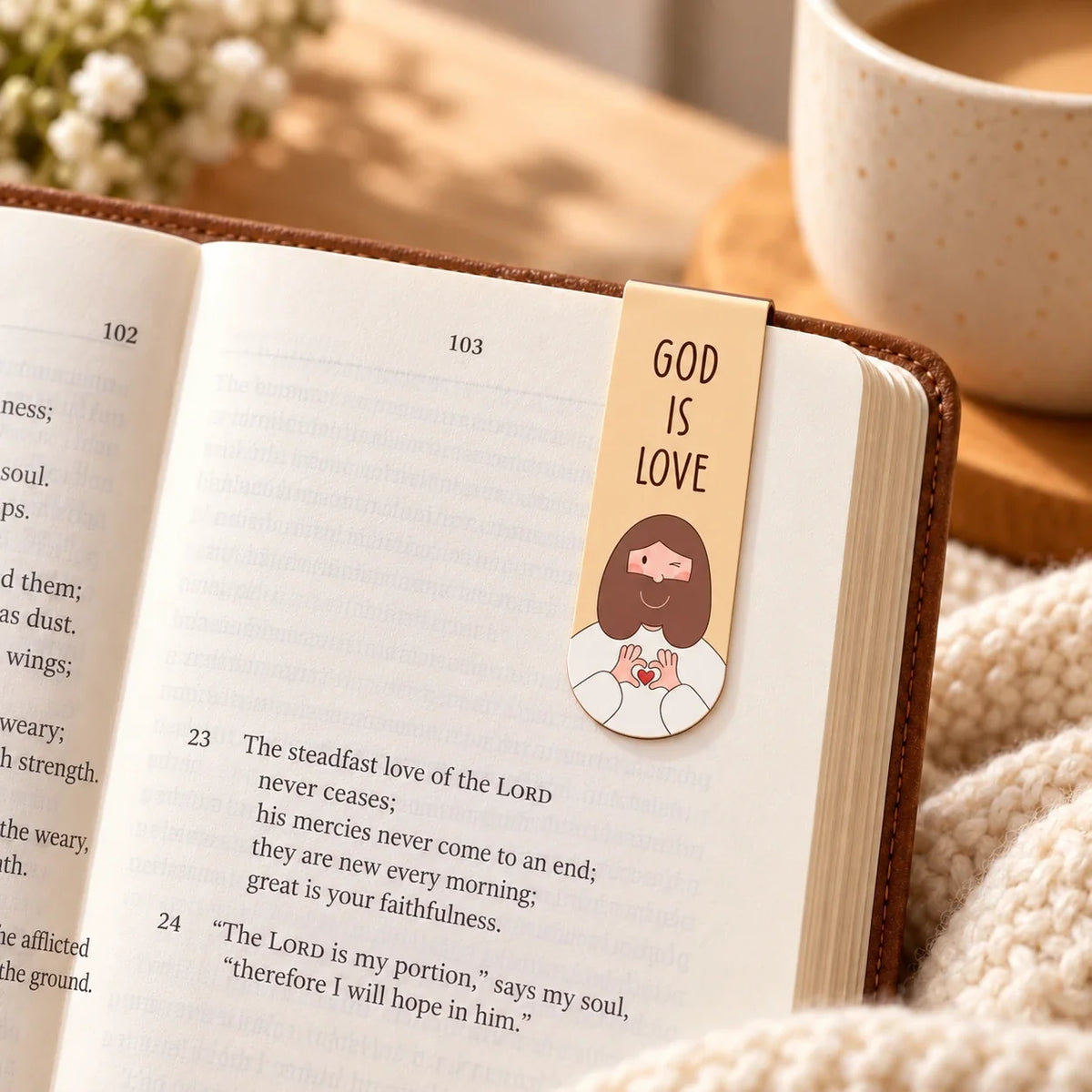 God Is Love magnetic bookmark clipped to one Bible page