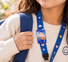 Rectangular Cool Child of God acrylic pin clipped to a blue lanyard