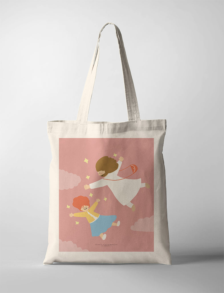 Canvas tote bag featuring an illustration of two joyful characters flying against a pink background with fluffy clouds, symbolizing freedom and happiness.