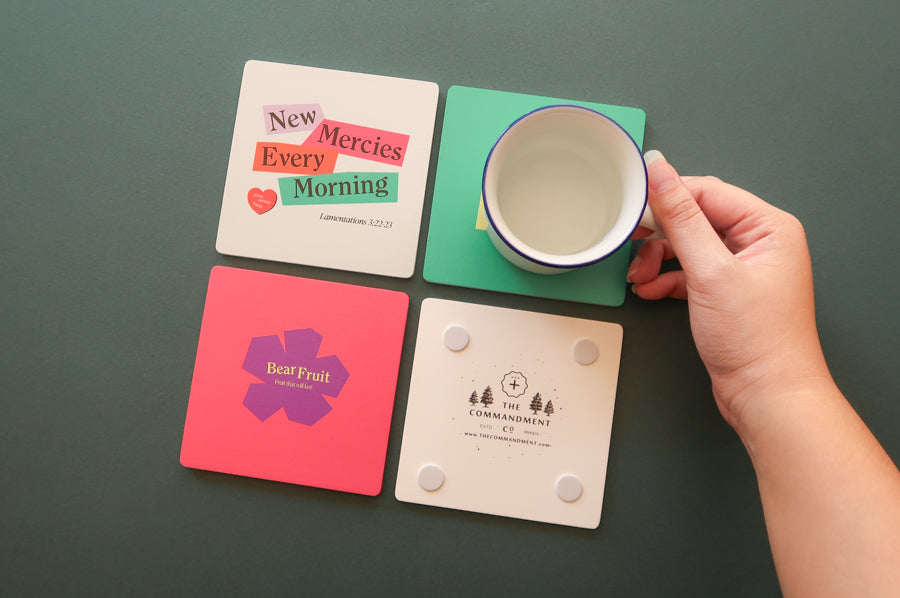 Colorful Christian Coaster: Square wooden coaster with simple geometric design.