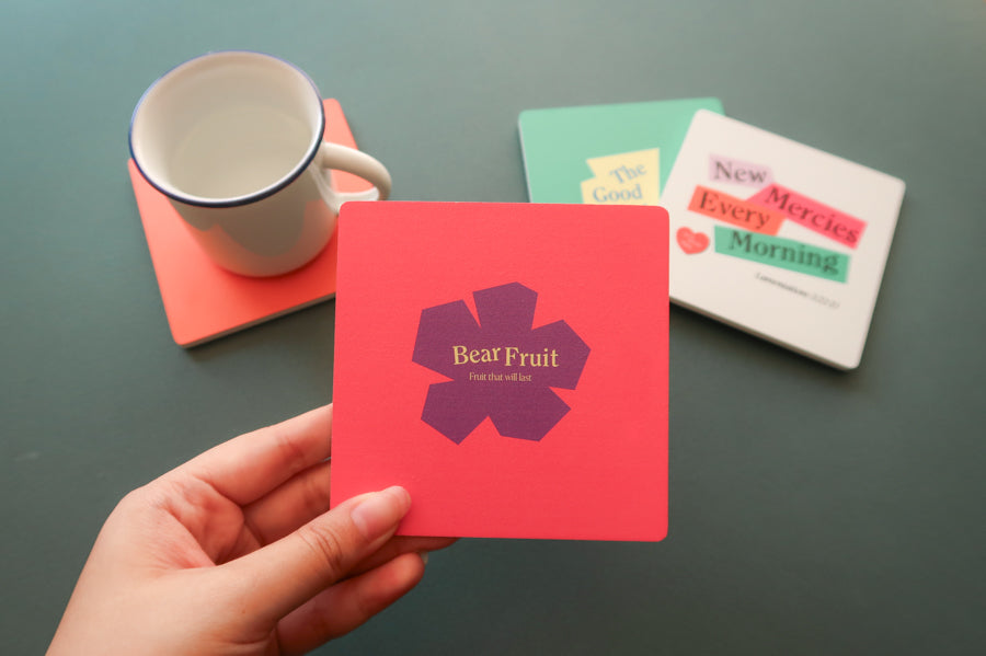 Colorful Christian-themed wooden coaster with geometric flair.