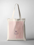 A soft pink tote bag with minimalist art featuring a delicate butterfly and the Bible verse Psalm 139:14: 'I praise you because I am fearfully and wonderfully made.' A simple yet elegant modern Christian gift for everyday use.