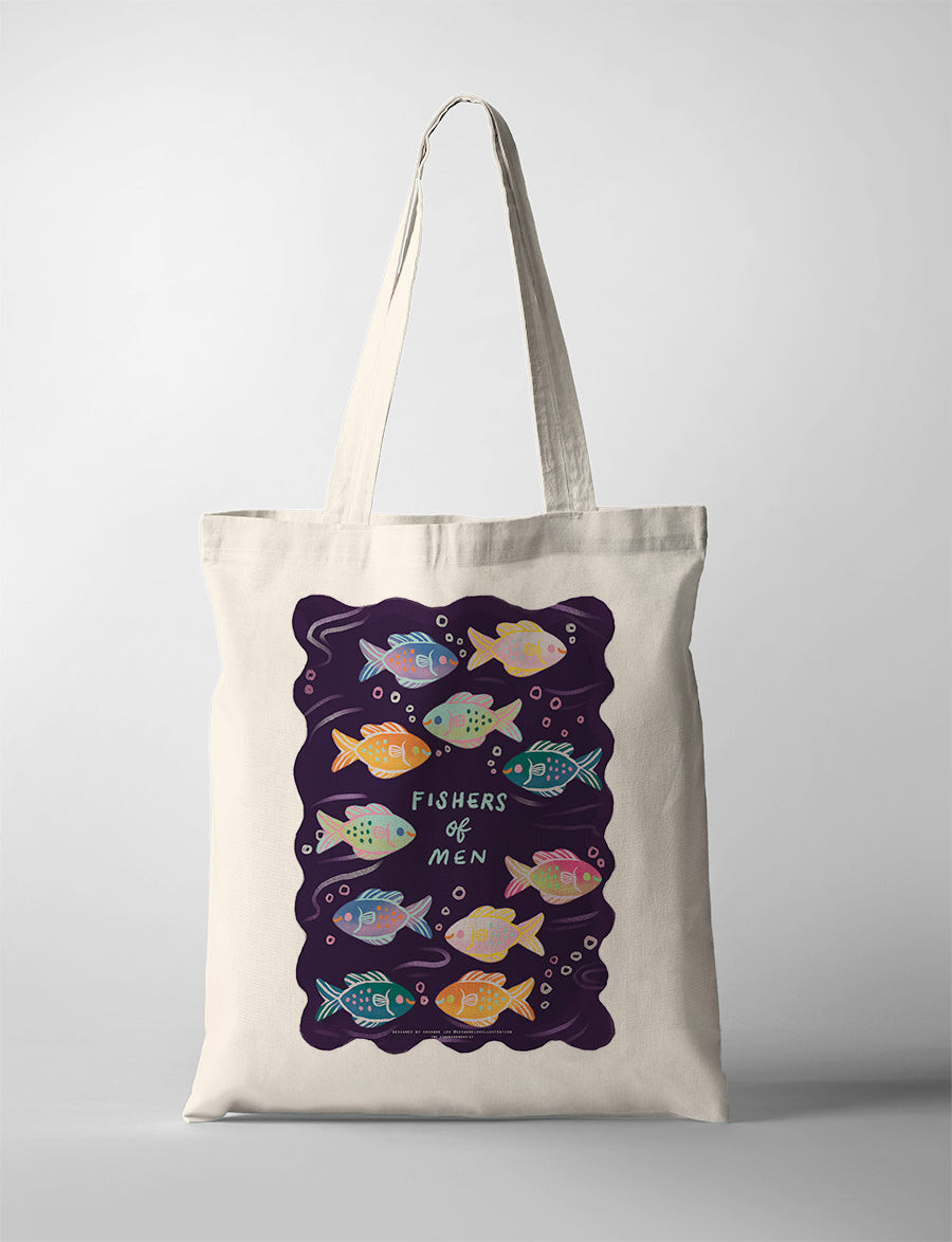 Faith based tote bag with a colorful fishes design on a cream background, hanging against a neutral wall. The bag's vibrant shapes symbolize unity and diversity in faith, offering a stylish and meaningful accessory for everyday use