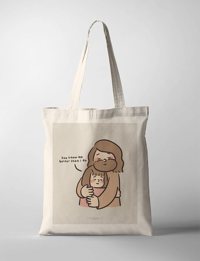 Canvas tote bag featuring a comforting illustration of Jesus hugging a child, with the words 'You know me better than I do,' symbolizing love and understanding.