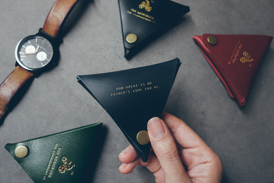 Compact genuine-leather coin pouch styled as a practical gift for dad.