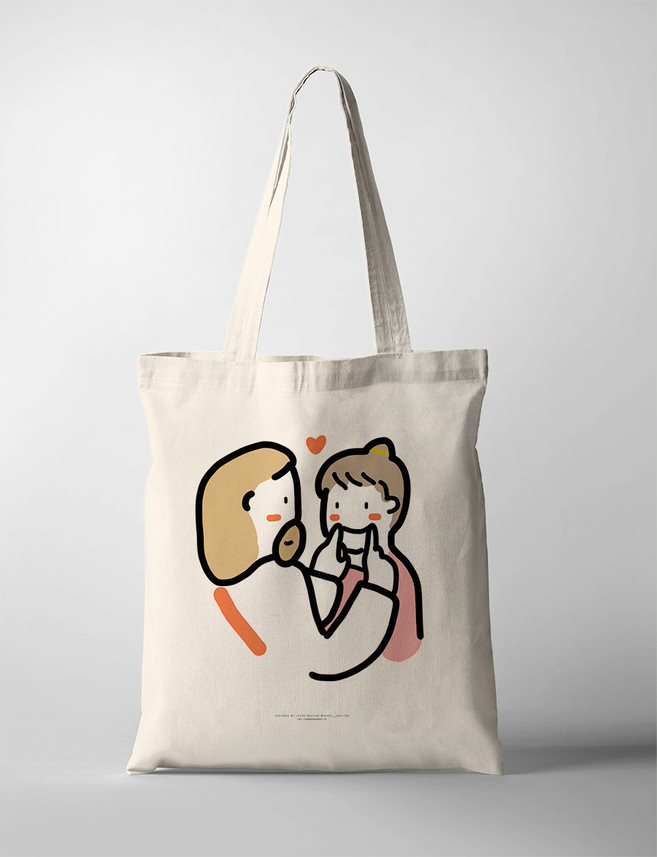 Christian tote bag with a heartwarming illustration of Jesus gently lifting a child’s cheeks to make them smile, showing tender love and care.