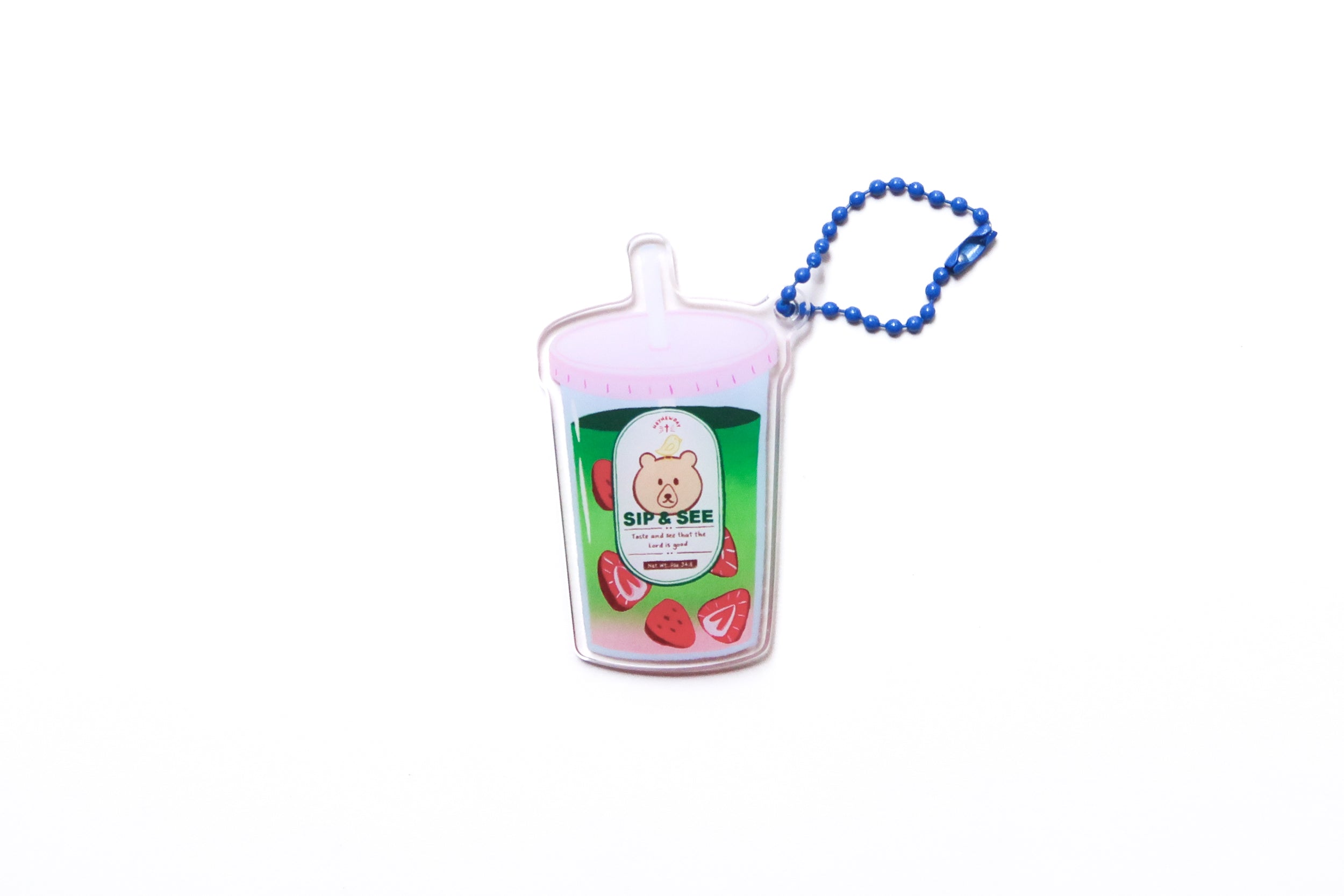 Sip & See strawberry matcha drink acrylic keychain with blue ball chain on a white background, designed with a bear graphic and Psalm 34:8.