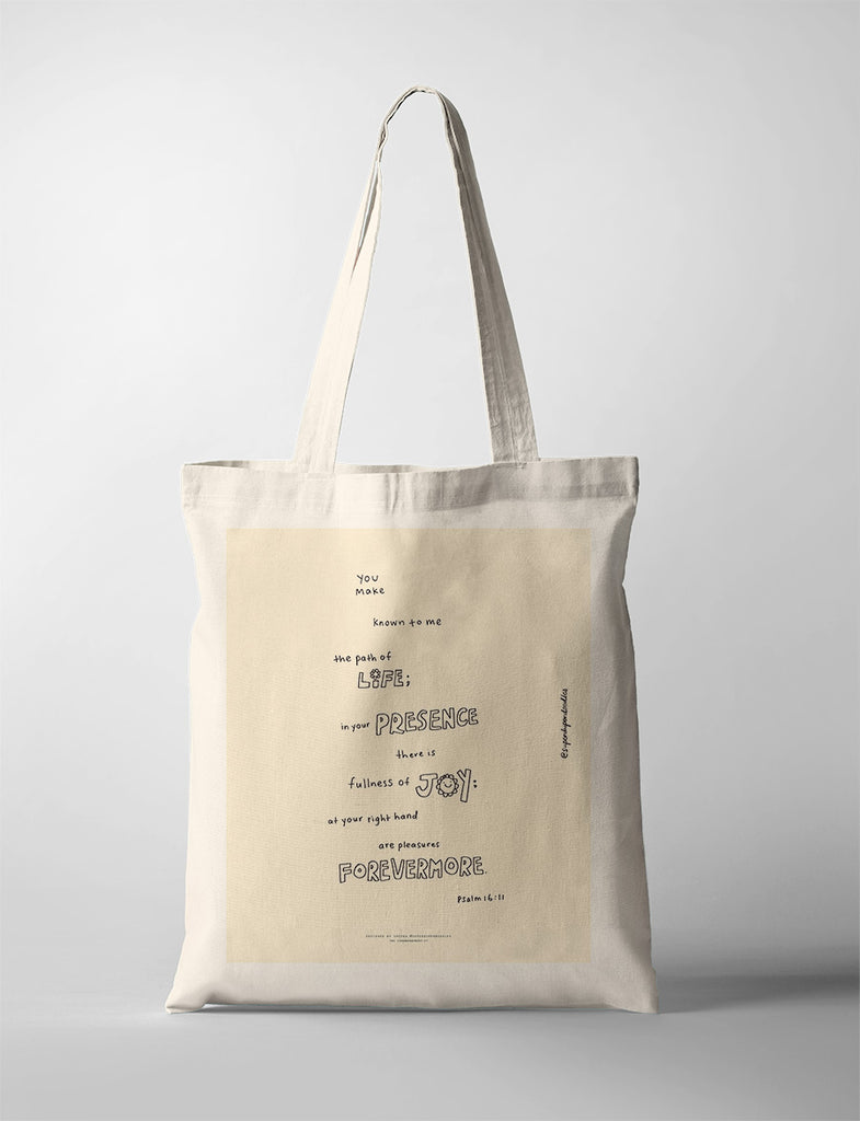 Elegant tote bag with Psalm 16:11 scripture 'In your presence is fullness of joy' on a beige background