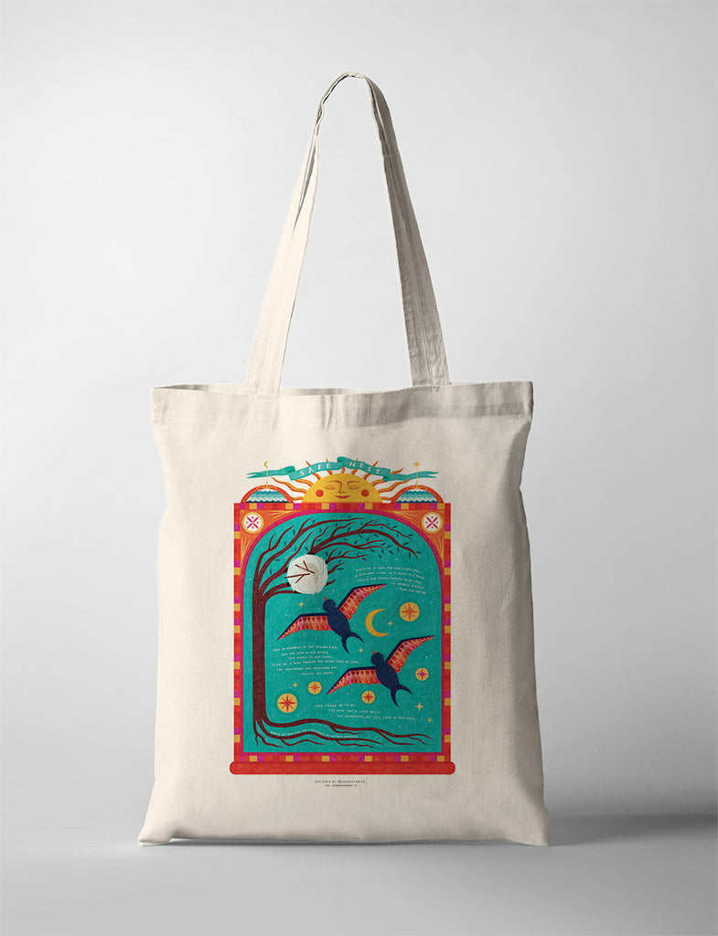 Canvas tote bag featuring a colorful design with birds, a tree, and celestial symbols, titled 'Safe Nest.'