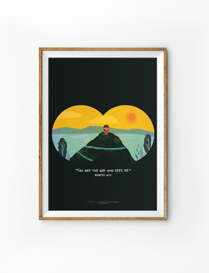 A framed Christian art print featuring a child standing on a mountain peak, viewed through a lens-like frame against a dark background. The Bible verse from Genesis 16:13 reads, 'You are the God who sees me,' symbolizing God's watchful presence.