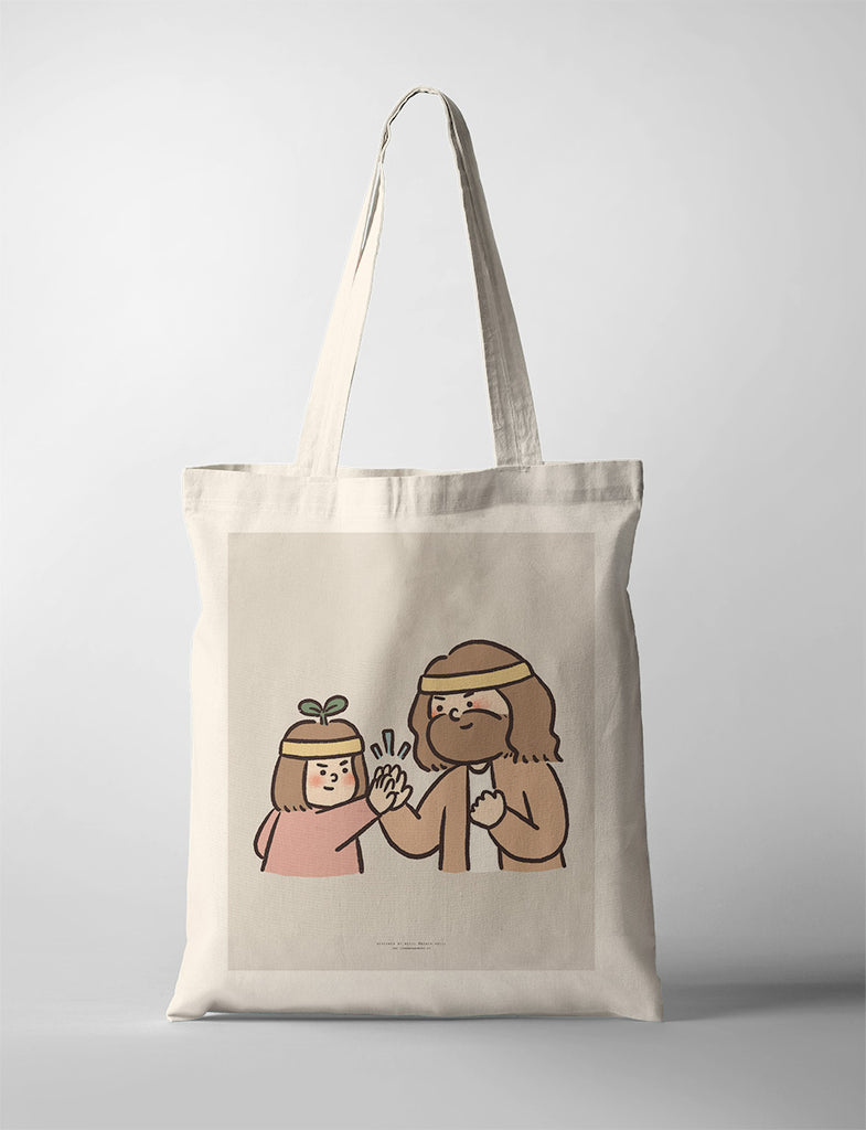 Canvas tote bag featuring an encouraging illustration of Jesus and a child in matching headbands, sharing a joyful high-five, symbolizing teamwork and support.