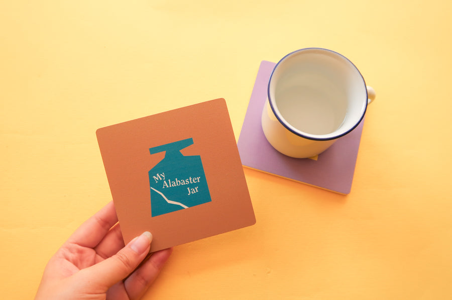 Divine Wooden Coaster Pack: Colorful square coasters adorned with Christian symbols.