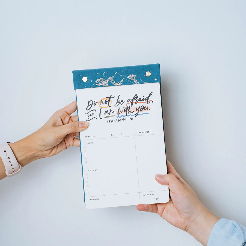 Christian notepad by The Project J with a blue cover, featuring the uplifting Bible verse "Do not be afraid, for I am with you" from Isaiah 41:10, designed for daily planning and spiritual encouragement.