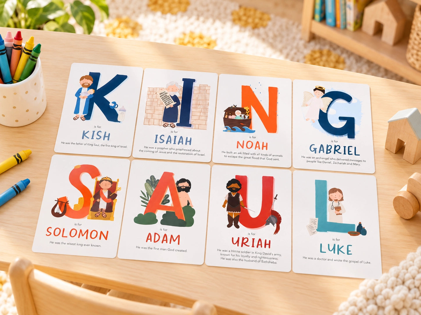 A-Z Bible Character Flashcards Set arranged on a children's activity table