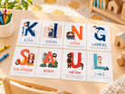 A-Z Bible Character Flashcards Set arranged on a children's activity table