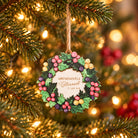 Abundantly Blessed Christian Christmas wreath ornament hanging on a warmly lit Christmas tree.