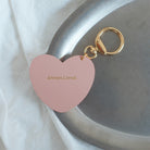 Heart-shaped pink keychain engraved with 'Always Loved,' a faith-inspired accessory with a minimalist design, ideal as a thoughtful gift.