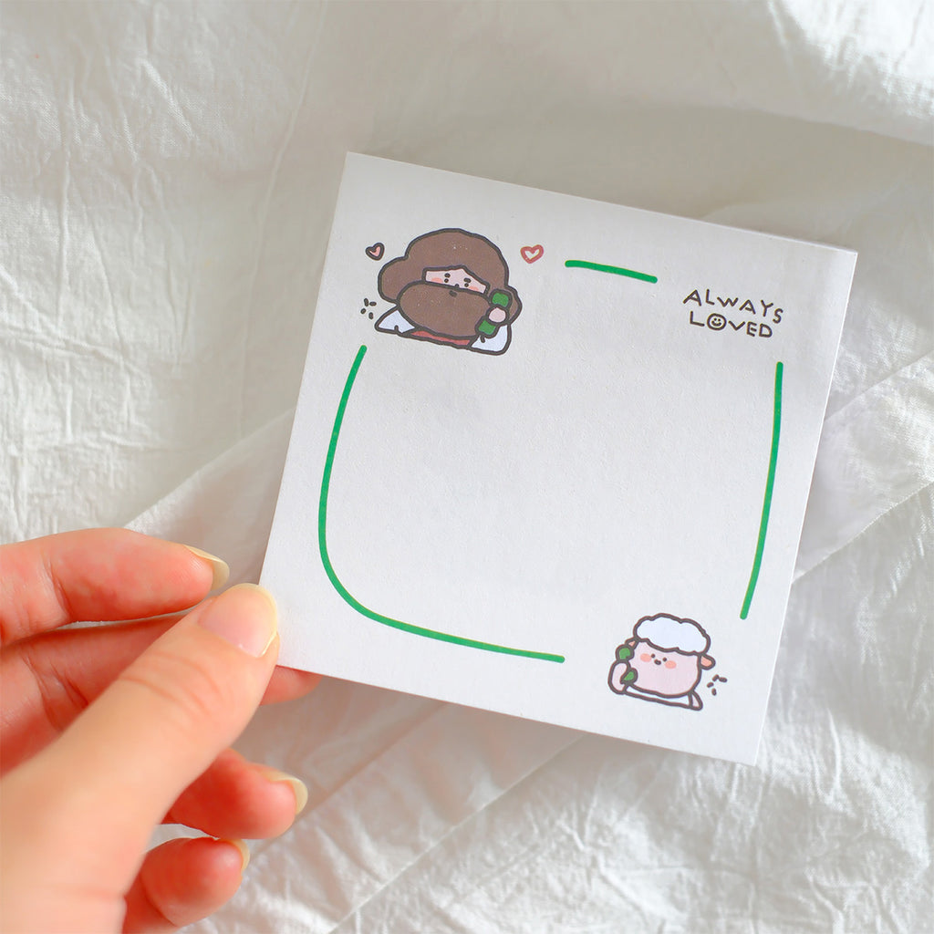 Christian-themed sticky note with green accents, featuring illustrations of Jesus and a sheep in opposite corners and the phrase 'Always Loved' in the top corner, designed for inspirational stationery.