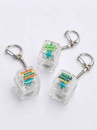 AMEN AMEN, Hallelujah and Super Blessed light-up keycap keychains displayed on a light grey background