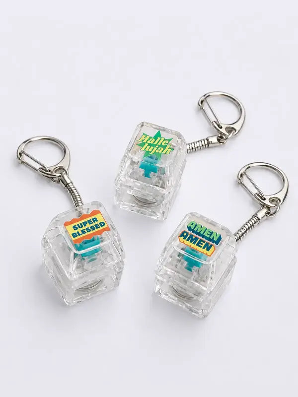 AMEN AMEN, Hallelujah and Super Blessed light-up keycap keychains displayed on a light grey background