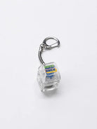 AMEN AMEN light-up Christian keycap keychain with clear body and silver clasp on a light grey background