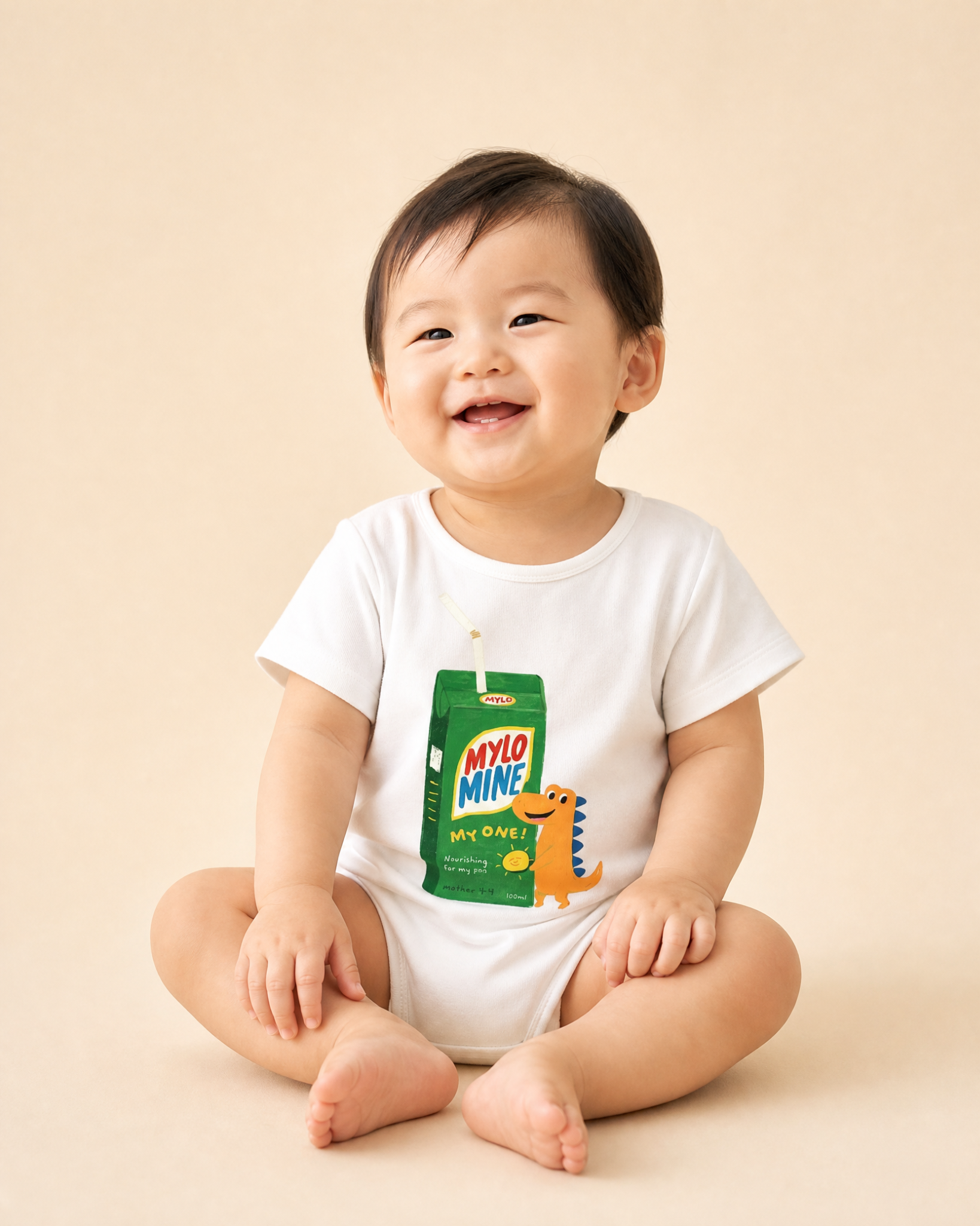 Baby wearing the Mylo Mine dinosaur drink packet Christian romper