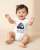 Smiling baby wearing a white Policemen to the Rescue romper with Jesus driving a police car