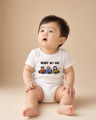 Smiling baby wearing a white Ready Set Go Christian romper with Jesus and children in race cars
