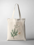 Christian tote bag featuring “Be Still, My Soul” with green botanical artwork and a flying bird illustration