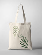 Christian tote bag featuring “Be Still, My Soul” with minimalist green botanical leaf illustrations
