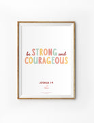 Christian wall art print featuring “Be Strong and Courageous” from Joshua 1:9 in pastel typography, collaboration with Charidesigns.