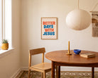 Better Days with Jesus poster displayed in a bright modern dining room with warm wooden furniture