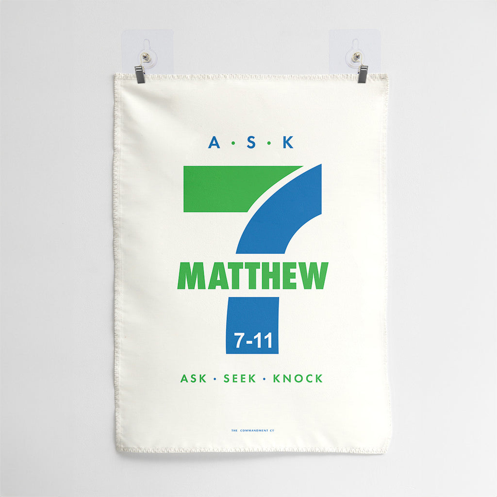 Minimalistic wall art featuring the text 'Matthew 7:11' with 'Ask, Seek, Knock' in bold green and blue, inspired by the Bible verse.