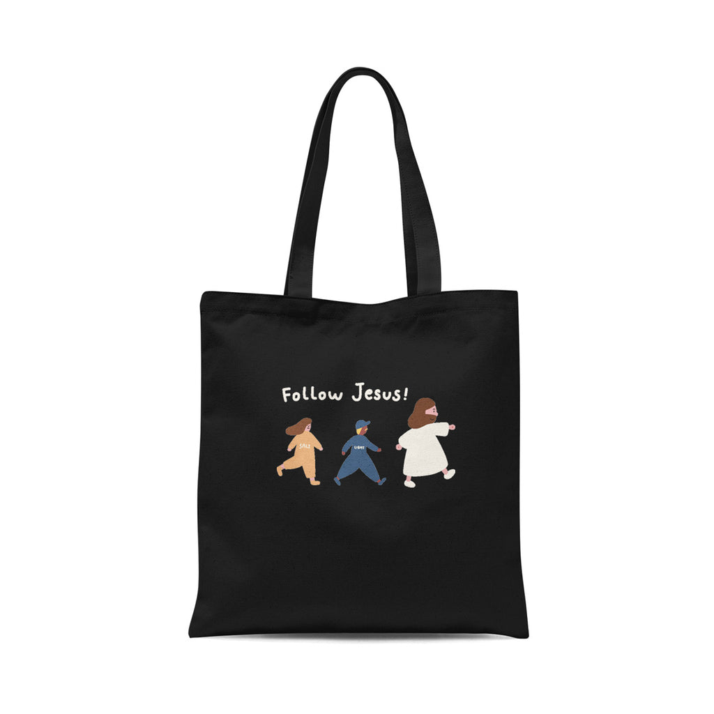 Black tote bag featuring the text 'Follow Jesus!' with hand-drawn illustrations of three figures representing salt, light, and Jesus walking forward