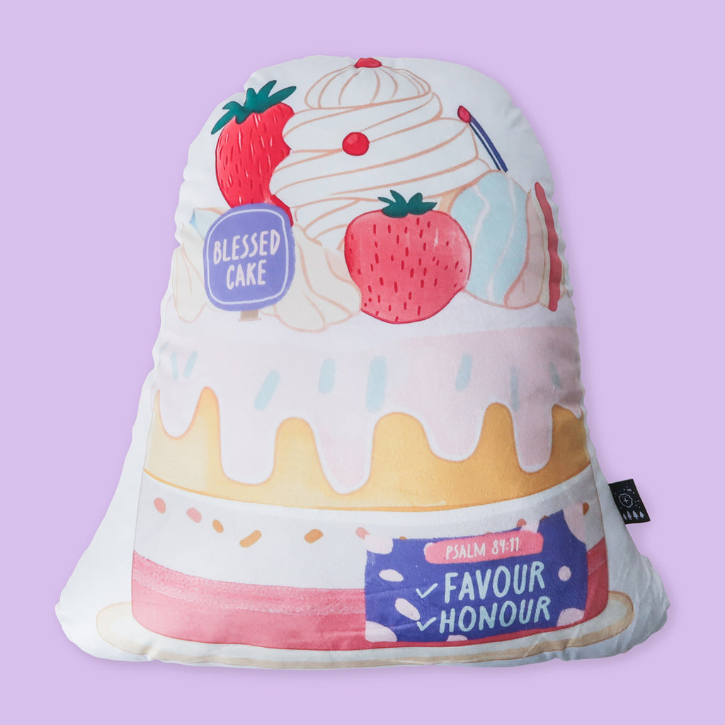 Christian-inspired plush toy pillow in the shape of a strawberry-topped cake, featuring Psalm 84:11, 'Favour and Honour,' for faith-based decor.