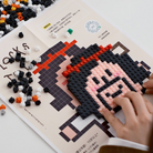 Hands assembling the Bravely Walk Towards You micro block building set, featuring a joyful pixel art character, inspiring hope, light, and simple happiness through creative play. 