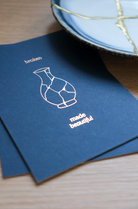 Elegant navy letterpress wall art featuring a kintsugi-style vase and the phrase “Broken Made Beautiful” in a clean, minimal design.