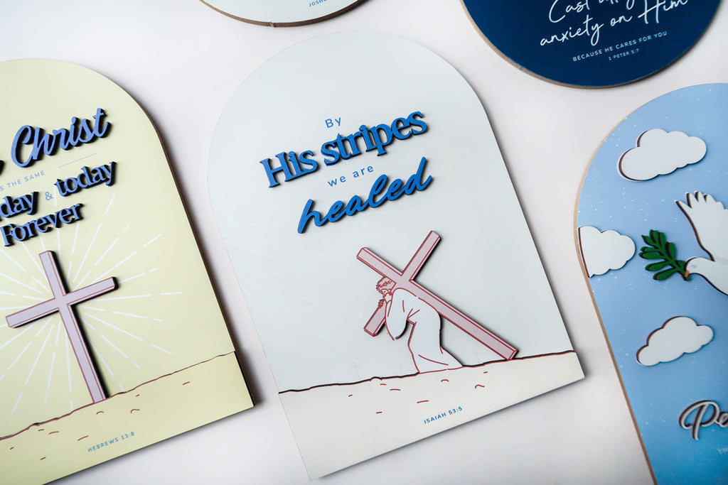 3D wooden Christian poster collection featuring the phrase 'By His stripes we are healed,' with an illustration of Jesus carrying the cross and the Bible verse Isaiah 53:5.