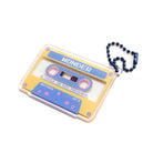 Acrylic cassette-tape keychain featuring the word “WONDER” on a yellow-blue cassette design, attached to a blue bead chain—a faith-inspired gift from The Commandment Co.