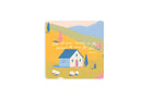 Christian coaster featuring a peaceful hillside scene with a small house, sheep, and the verse “Cast all your anxiety on Him because He cares for you” from 1 Peter 5:7.