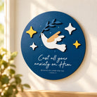 Cast All Your Anxiety on Him 3D dove poster featuring 1 Peter 5:7 on a bright cream wall.