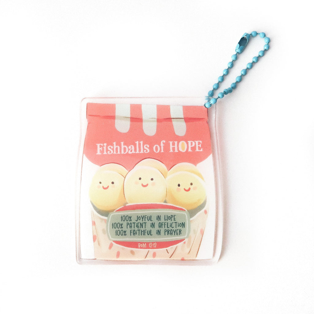 Faith-based keychain featuring ‘Fishballs of Hope’ with cheerful faces and Romans 12:12, symbolizing joy, patience, and prayer